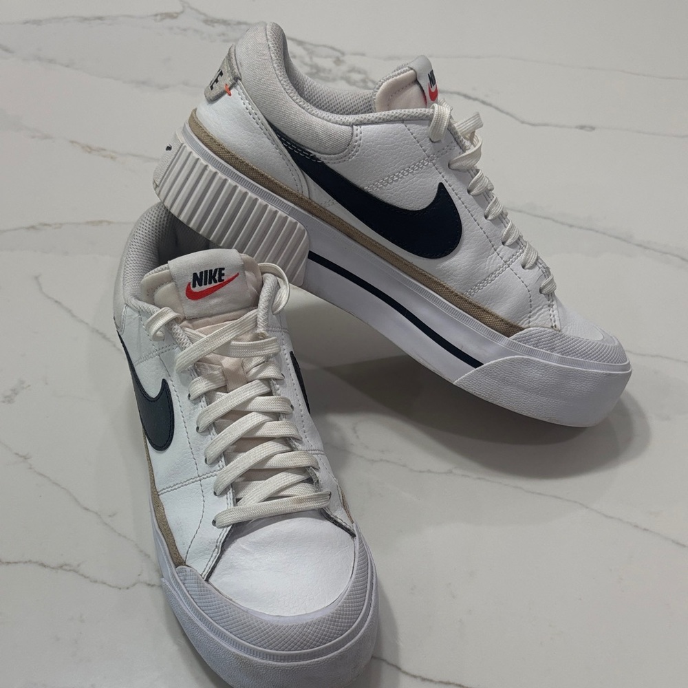 Nike White Low-Top Sneakers with Navy Swoosh and Gold Trim